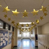 image:imageOutus 24 Pieces 11 Inch Large Gold Stars Cutouts Gold Stars Decoration Double Printed Paper Star for Movie Night Bulletin Board Decoration Classroom Wall Party Decor Back to Shcool Party Decor72