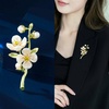 image:imageWCRAZYE Pearl Flower Brooches Pin for Women Girls Gold Plated Fashion Elegant Green Leaf Botanical Floral Lapel Brooch Dress Accessories Cute Wedding Valentines Day Birthday Jewelry Gift SouvenirFlower Brooch 1